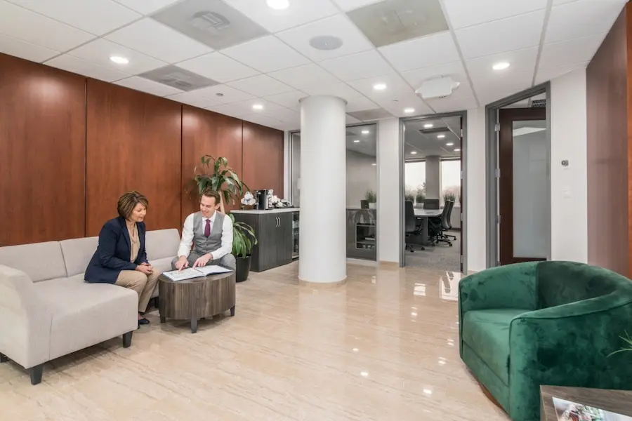 DuPage County collaborative divorce attorney Michael Biederstadt consulting with client in his Oak Brook Terrace office.