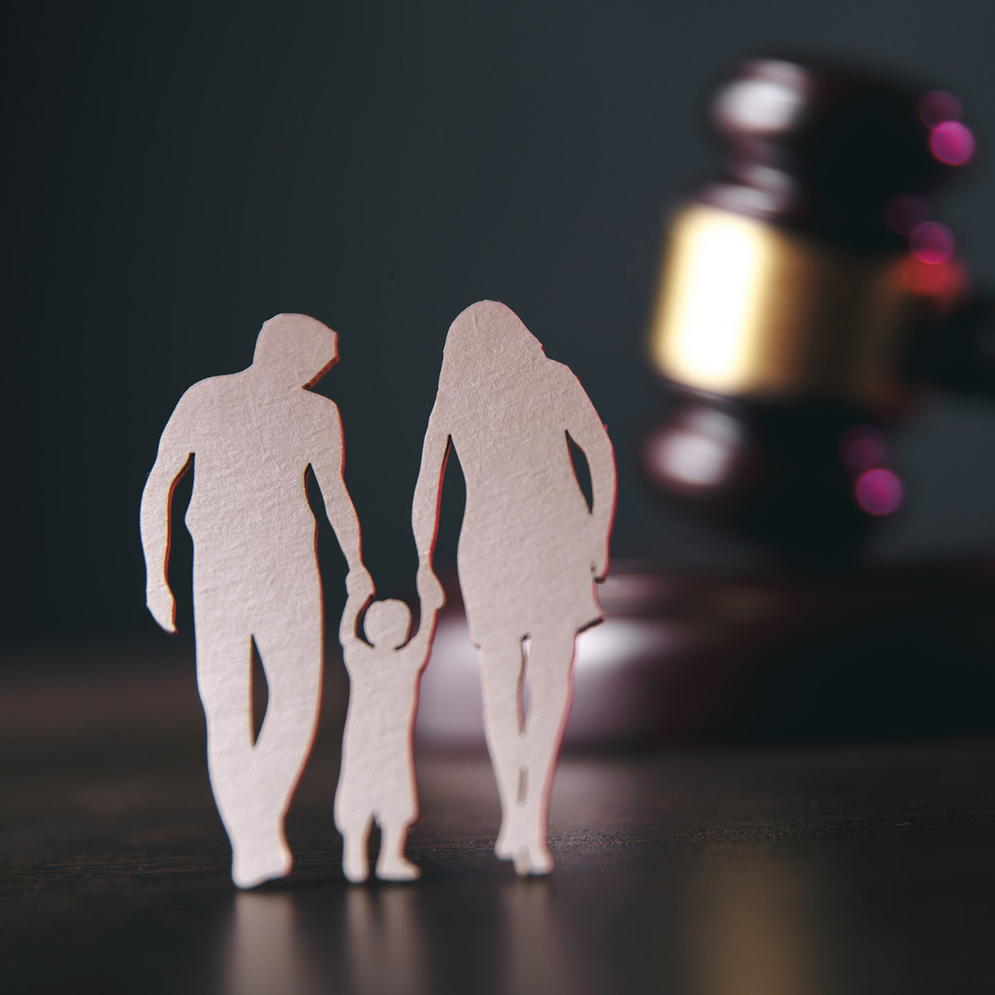 Family figure and gavel on table. Family law