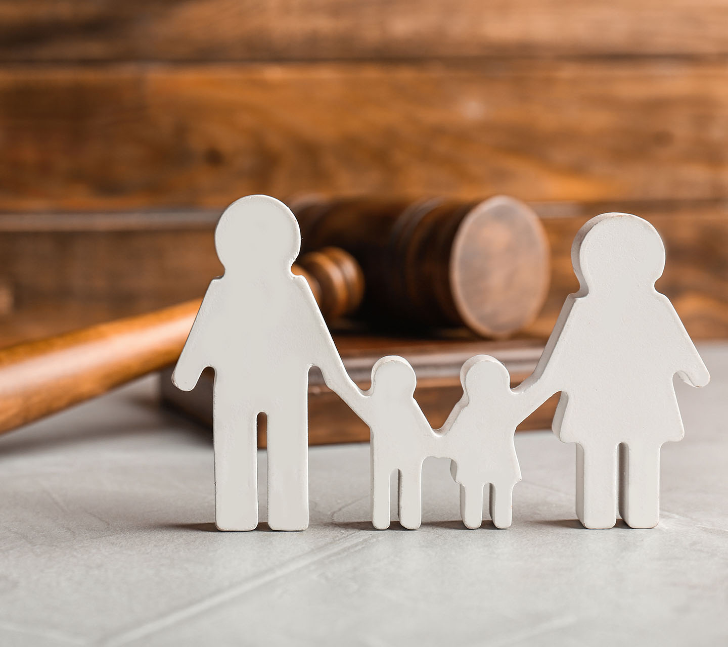 Family figure and gavel on table. Family law concept